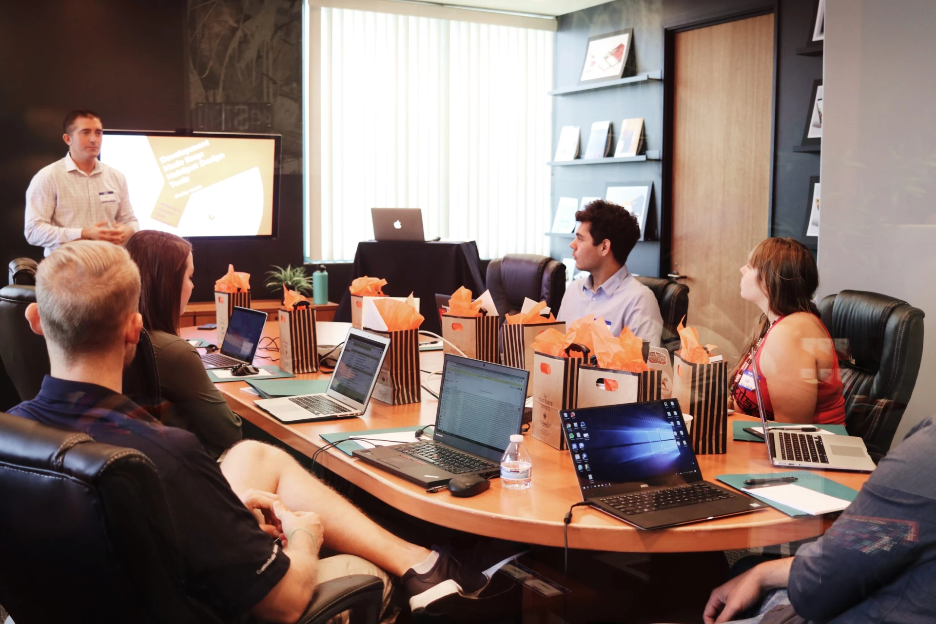 manager leading a meeting in office image by Unsplash