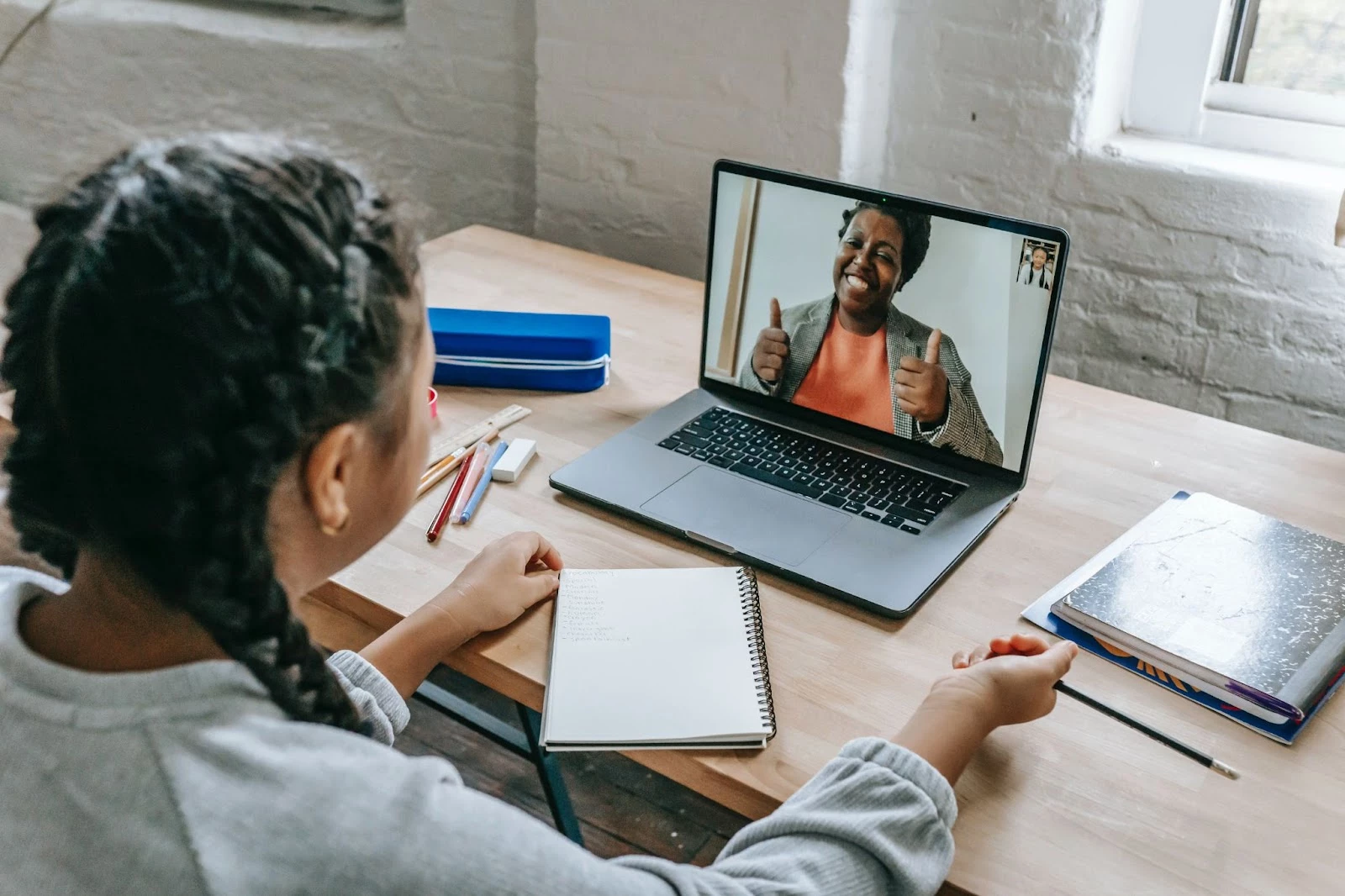 Image depicting a girl learning online