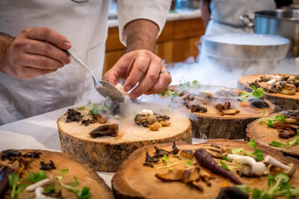 A chef preparing a dish in a restaurant